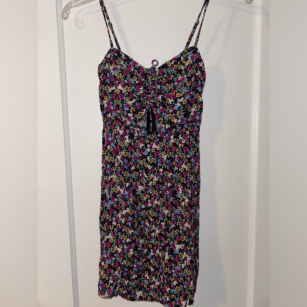 Barely worn, mini dress with cut out on the front. Can fit like an xs (2,4).